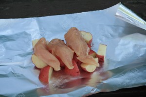 Place chicken breast or tenderloins on top of potatoes.
