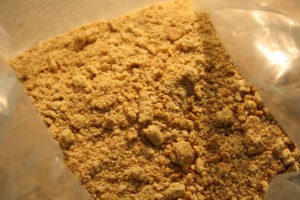Add 1/4 cup of brown sugar and melted butter to bag. Mix to combine.