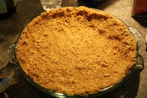 Pour mixture into pie tin and press down to form a crust.