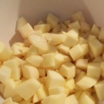 Put diced apples in a bowl with apple cider. Turn to coat apple pieces to prevent browning.