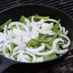 Peppers and onions in cast iron skillet